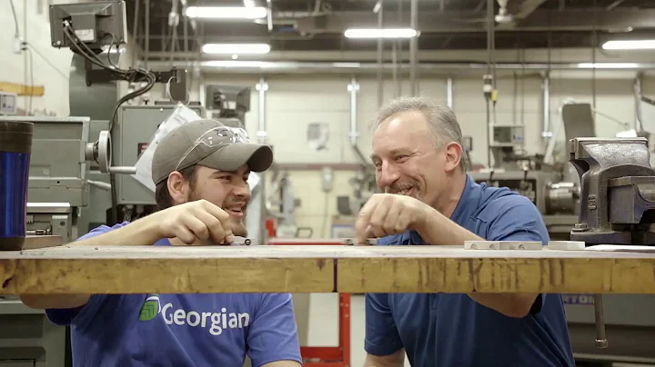 Prof. Mike Zacharko and Nicholas, his student, make a metal car