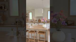 Bright Farmhouse Kitchen | White Cabinets, Wood Countertop & Warm Pendant Glow #homedecor #kitchen