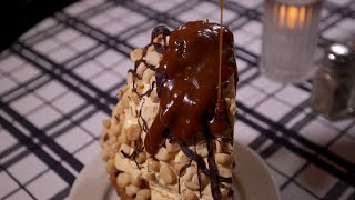 Chicago's iconic Gibson's Bar piles ice cream pie high with macadamia nuts, oozing chocolate sauce