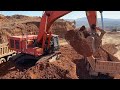Hitachi Zaxis 670LC Excavator Loading Mercedes &amp; MAN Trucks