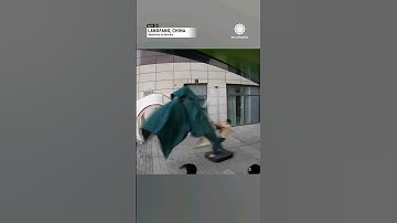 High Winds Take Man for a Ride on Umbrella