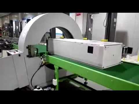 Horizontal orbital stretch wrapper and horizontal wrapping machine