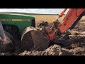 John Deere Combine and tractor get stuck in mud