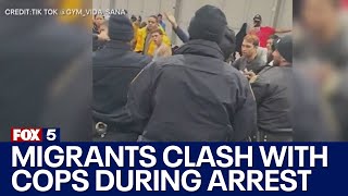 Migrants clash with cops during arrest