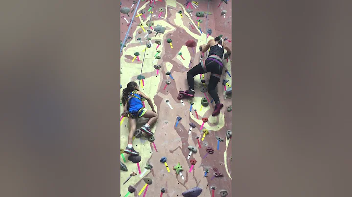 Lily and Rebekah Marine climbing a rock wall together!