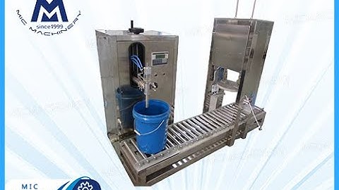 semi automatic weighing and filling machine: How Machine Fill oil products into barrel and cap it.