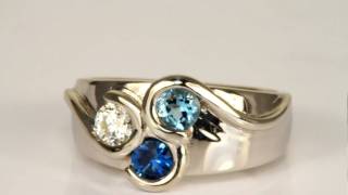 Three Stone Mothers Ring with Larger Stone designed by Christopher Michael