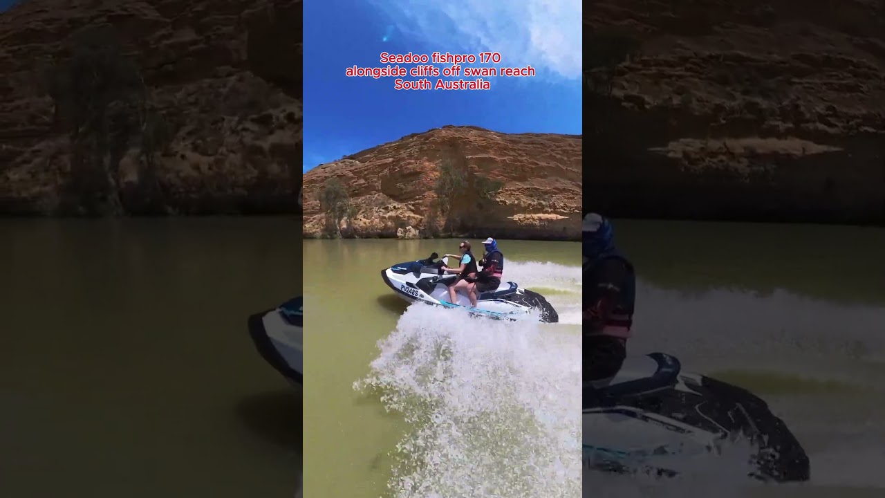Seadoo jetski cruising alongside cliffs