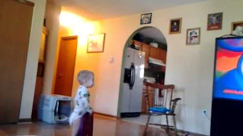 TEBOW LOVING CHILD by Joseph McCloud
