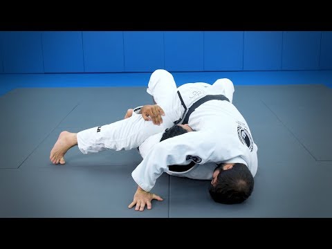 Attacks from the half-guard: A sweep with arm control