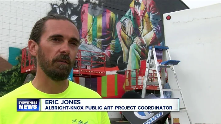 Famous painter painting mural on Hertel Ave.