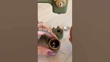 Person is making a custom button using a button press!