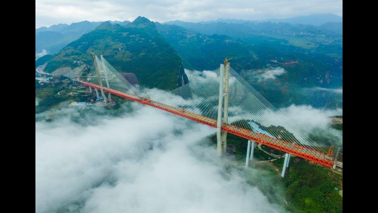 Concentración Absolutamente Si El impresionante puente colgante que construye China - YouTube