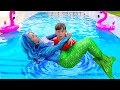 Senya and Mermaid Swim and Play in the Pool