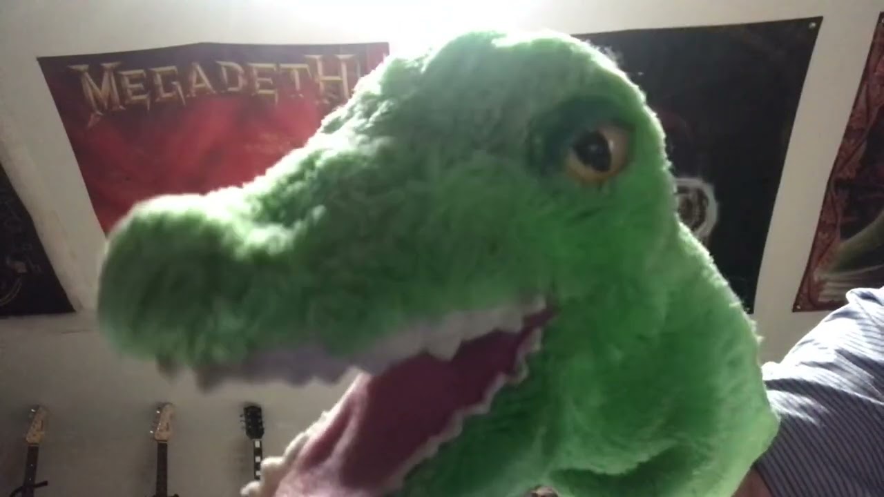 Alligator sings What A Wonderful World by Louis Armstrong “The Great