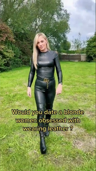 blonde walking in leather catsuit