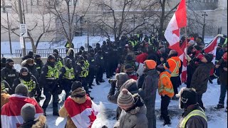 Protesters push back as police line moves forward