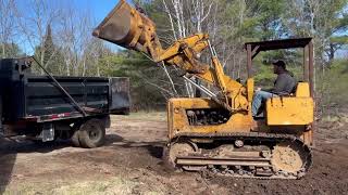 Old crawler loading trucks and moving dirt!