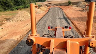 Spreading Stone On 1100' Of New Road