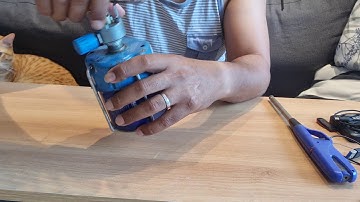 How to install a butane gas canister on a portable gas stove.