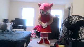 imperson man suiting up amy rose mascot