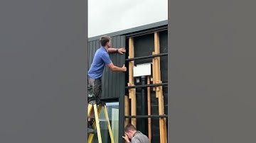 Brushed and Planed Thermopine® cladding coated with RAL9005 #claddinginstallation