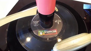 RCA 3 speed automatic record player / changer playing a stack of 45