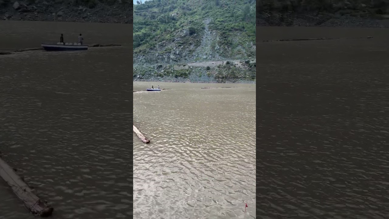 Installation of log boom in reservoir 