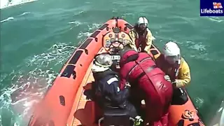 Alchemist crew rescue by RNLI inshore lifeboat during the 2016 Round the Island Race