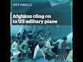 Lagu Afghans cling on to US Air Force plane
