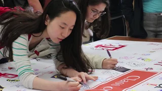 Seniors Sign College Banner
