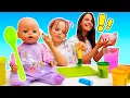 Maya is getting ready to feed her doll and is preparing toy food with her mom