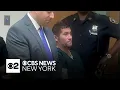 Man accused of killing coworker with machete shooting officer arraigned