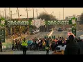 Runners lace their shoes for the Publix Atlanta Marathon