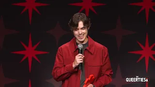 James Sweeney writer director star of Twinless accepts for COMEDY MOVIE at the Queerties Awards