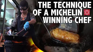 watch michelin star chef jay fai make her legendary crab omelet 