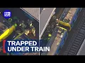 Rescuers save boy stuck under train 9 News Australia