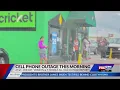People lined up outside Springdale Cricket because of cell phone outage