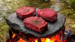garlic butter steaks and campfire potatoes outdoors