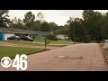 Neighbors on edge after woman sitting in her car was shot in Lithonia