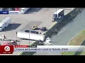 Truck into pond by Love s travel stop