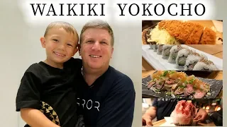 jay and luke walk through waikiki yokocho