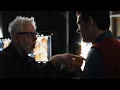 David Corenswet and James Gunn having a heated discussion about the monologue