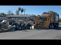 Valley Vista Services Front Load Garbage Truck on a Large Bulky Item Pile