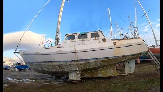 #24 She doesn’t have a wet bottom!  Awkward work on the underside of our steel yacht
