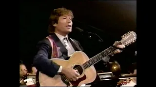 John performs “America The Beautiful” in 1995, symphony & choir conducted by Erich Kunzel