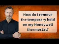 How do I remove the temporary hold on my Honeywell thermostat