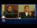Amber Heard holding back a laugh in court Johnny makes Amber laugh