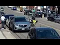 shows two cyclists get doored by Tesla in Hamilton