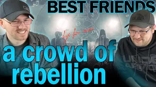 a crowd of rebellion under the split tree reaction best friends react